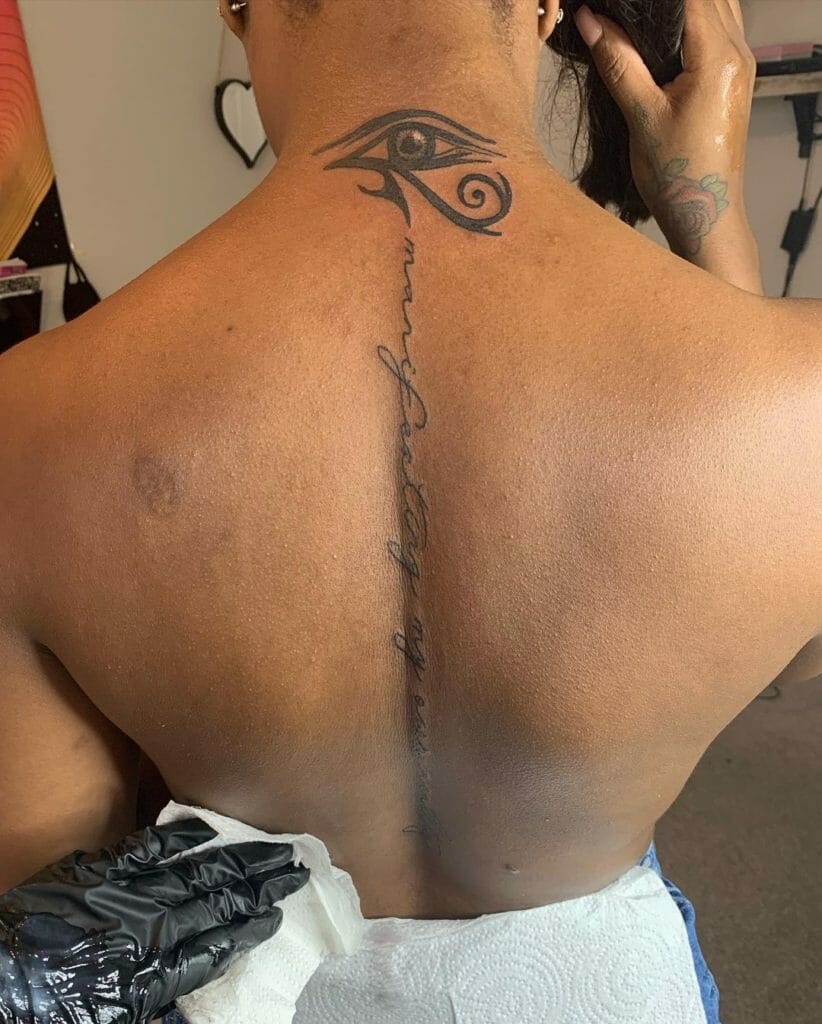 Eye Of Horus Tattoo Along Spine