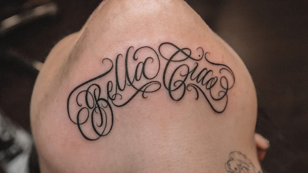 Lettering Chin Tattoos