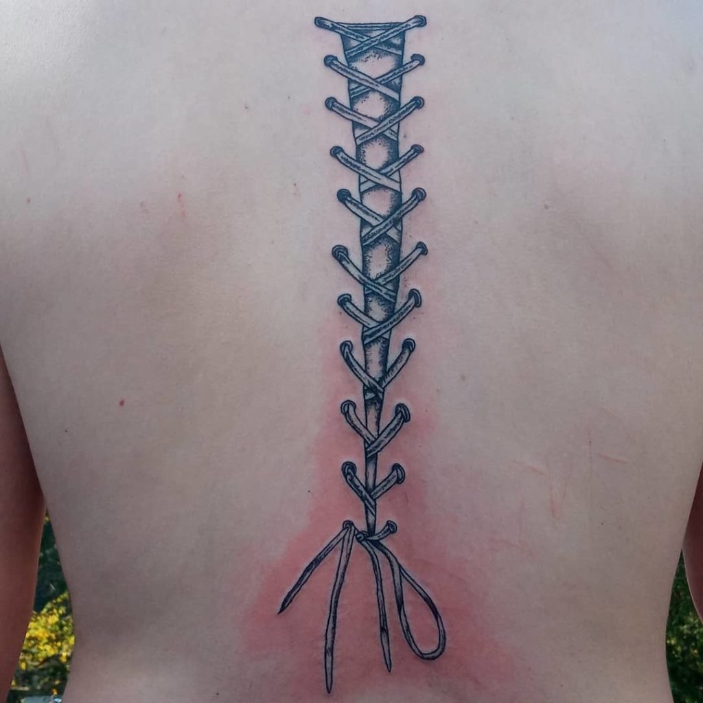 Simple Corset Stitch Tattoo For Your Back
