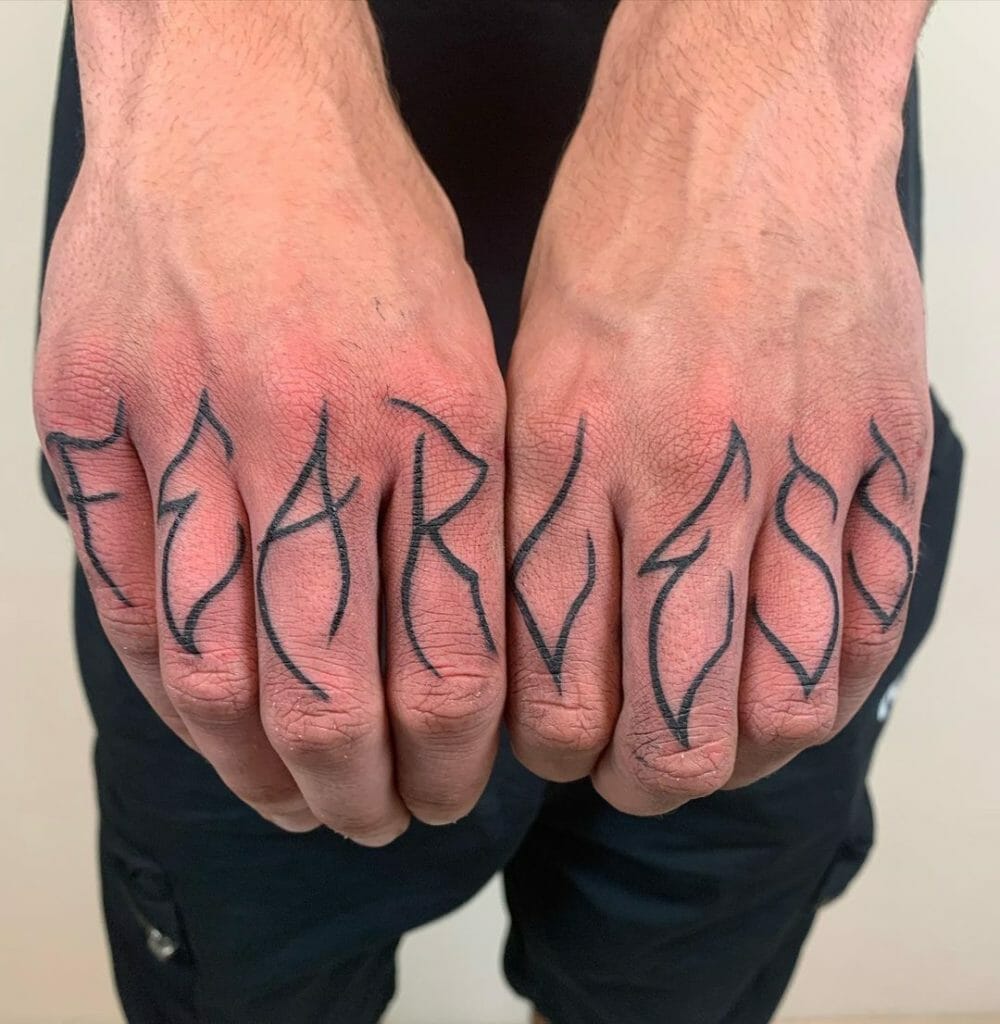 Unconventional Finger Tattoo Designs With The Word 'Fearless'