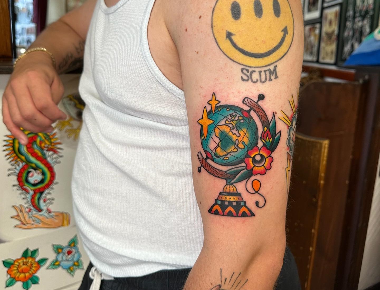Globe tattoo on the upper back - Tattoogrid.net