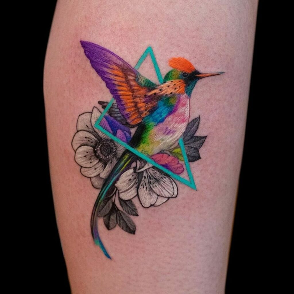 A Radiant Flower And Hummingbird Tattoo