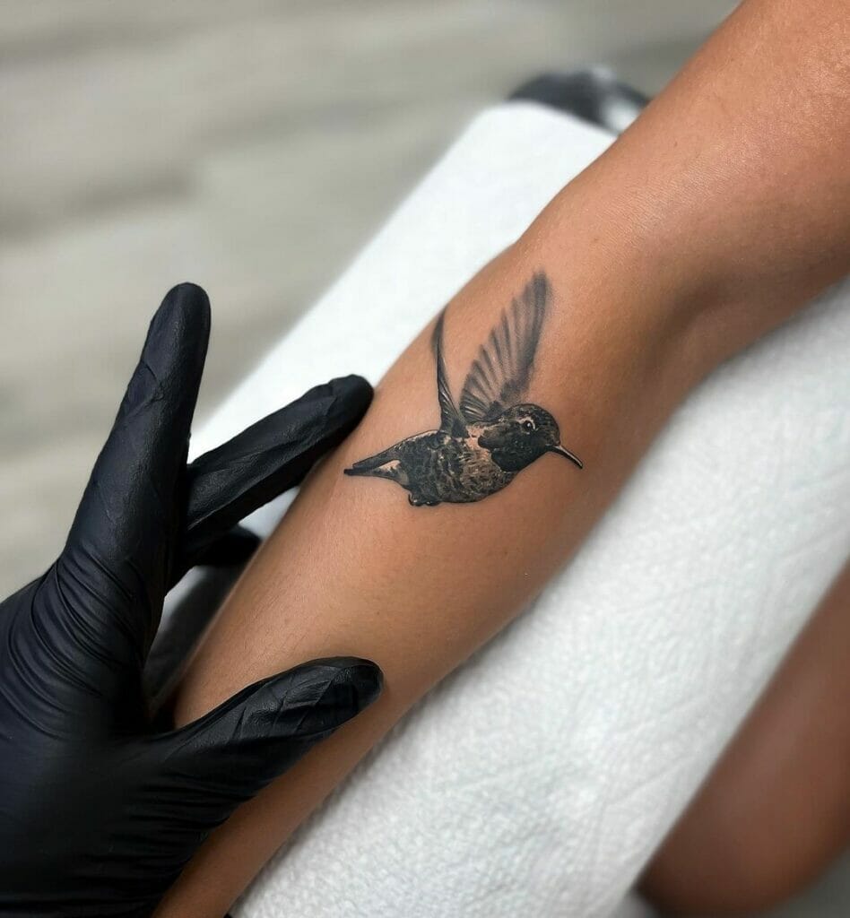 A Stunning Black Hummingbird Tattoo