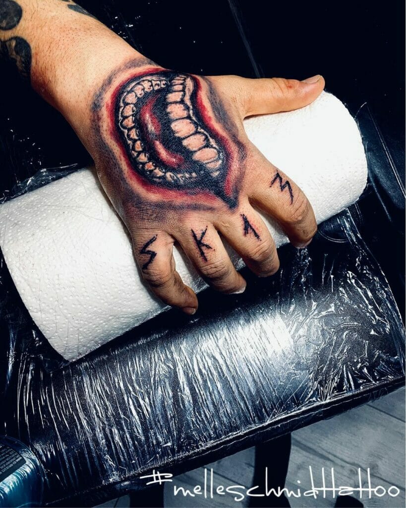 Dark And Gritty Joker Hand Tattoo Designs