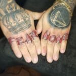 Fear None Hand Tattoo