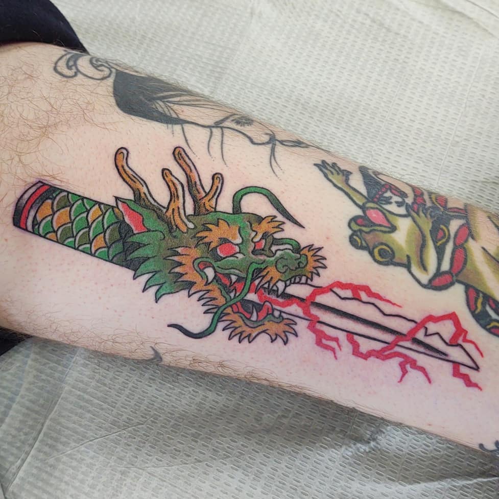Inner Thigh Dragon And Dagger Tattoo