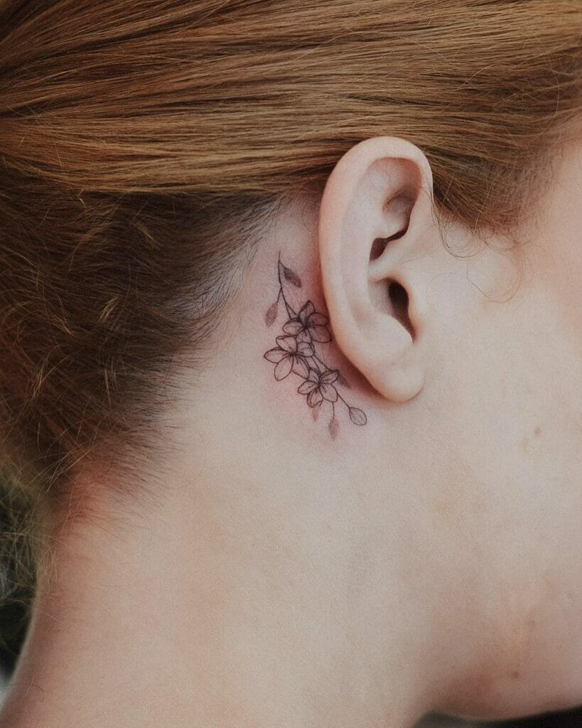 Tiny Behind The Ear Japanese Cherry Blossom Tattoo Design