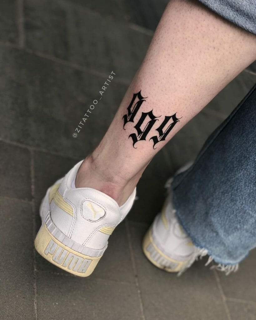 999 Leg Tattoo In Gothic Lettering