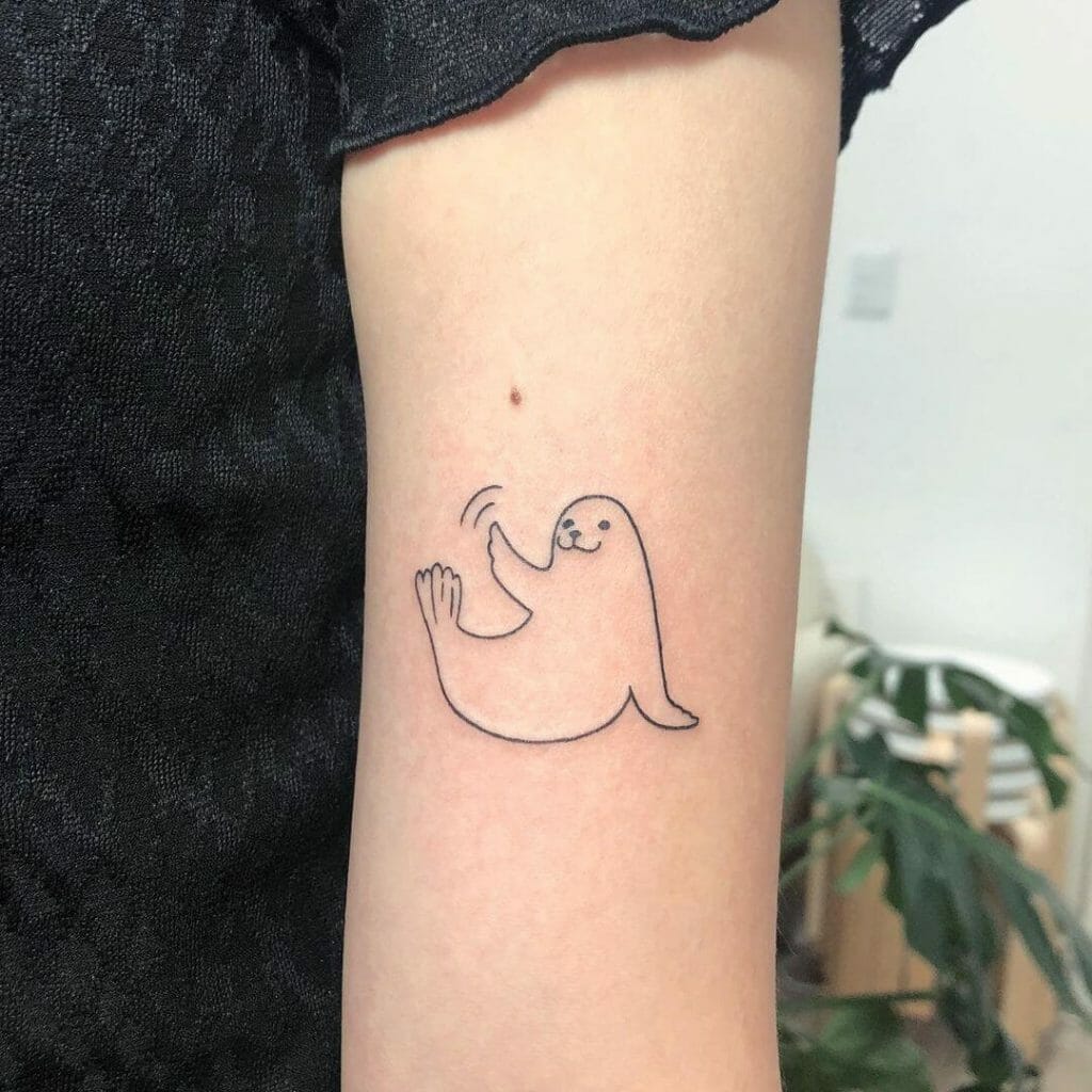 A Simple Line Art Baby Seal Tattoo