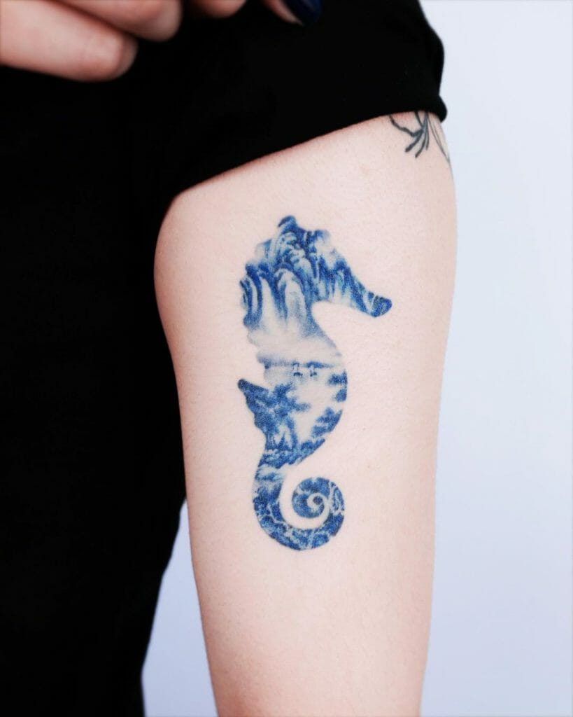 Blue Seahorse Tattoo On Arm