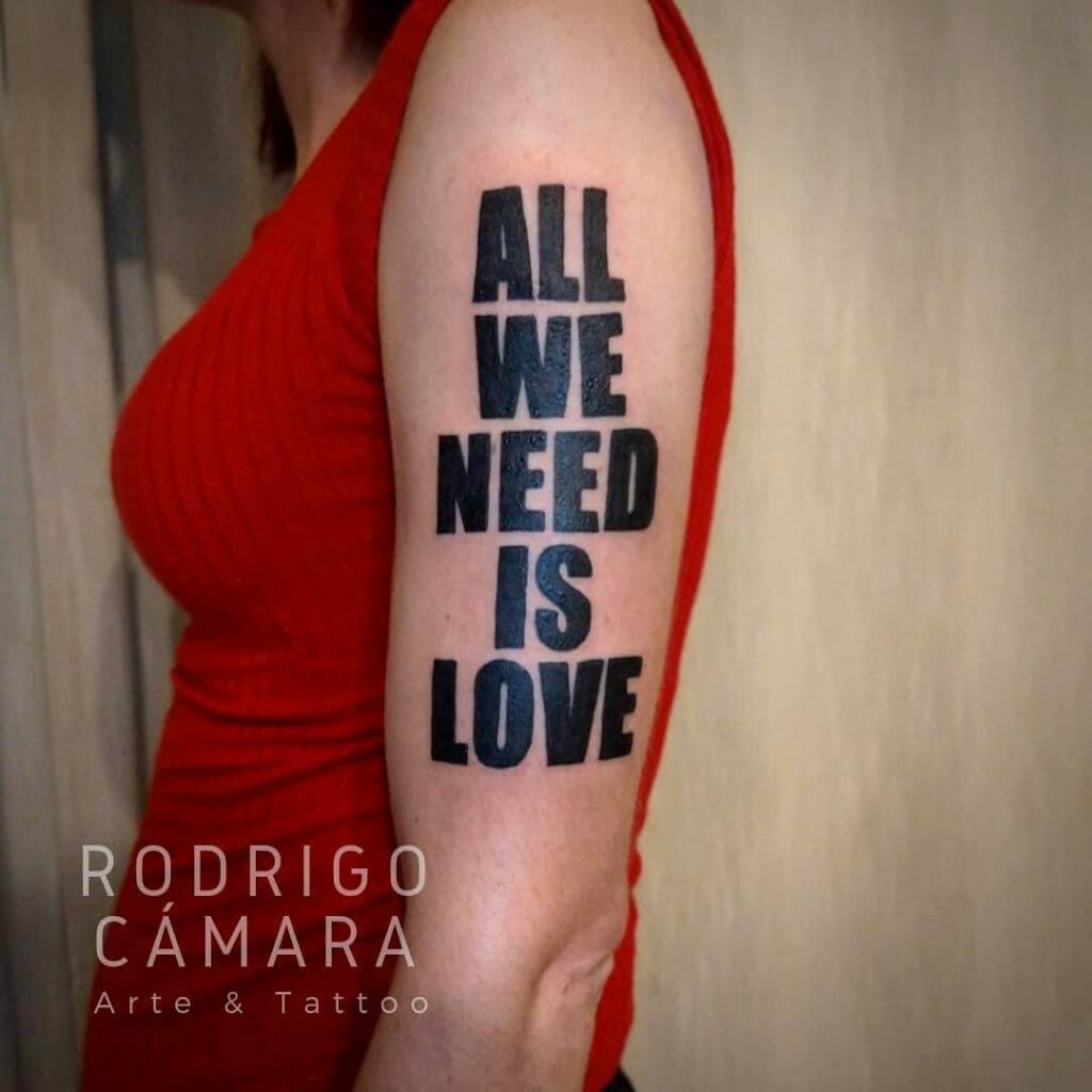 Bold All We Need Is Love Arm Tattoo