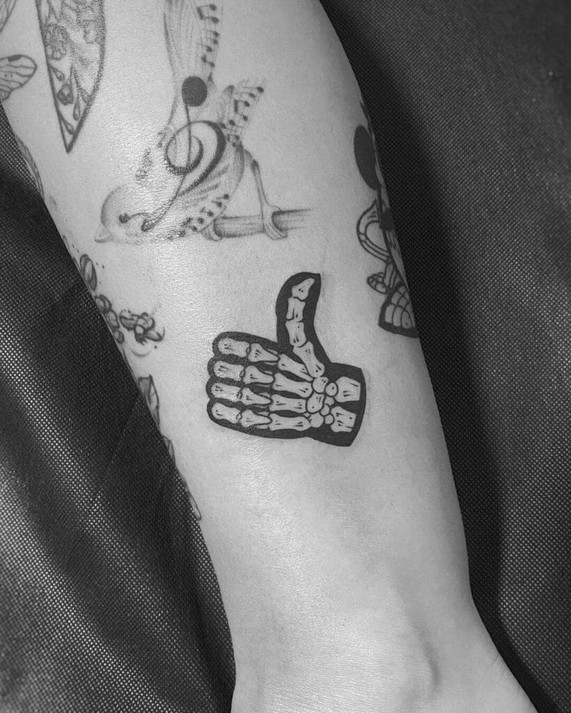 Bony Thumbs Up Emoji Tattoo