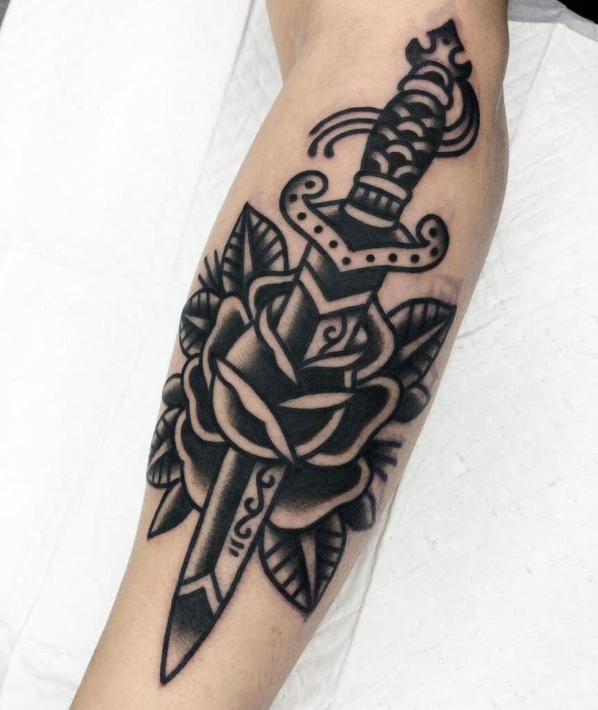 Charcoal Black Rose And Dagger Tattoo