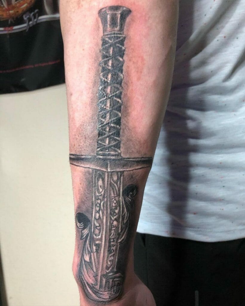 Extensive Black Excalibur Forearm Tattoo