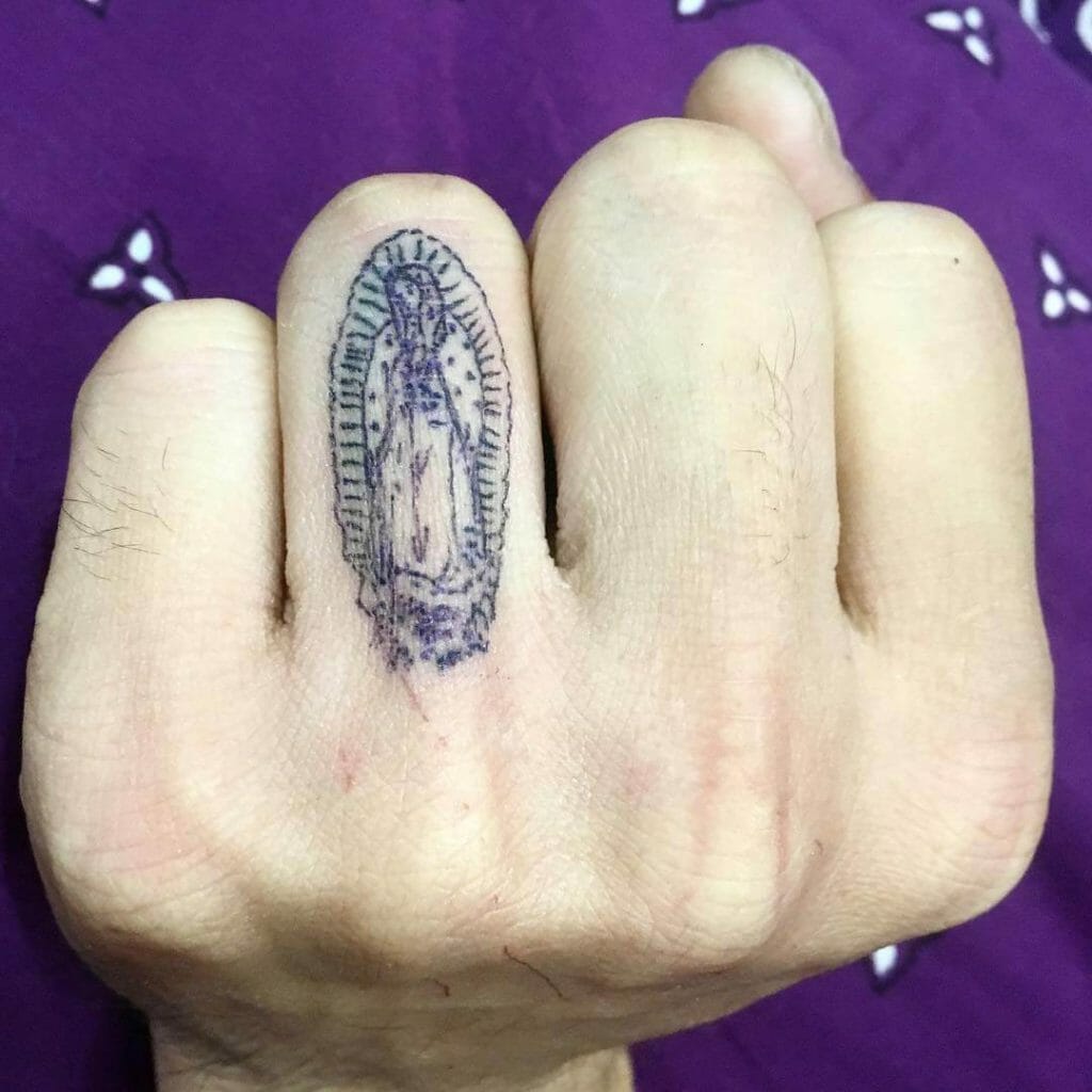 Finger Tattoo Of Virgen De Guadalupe