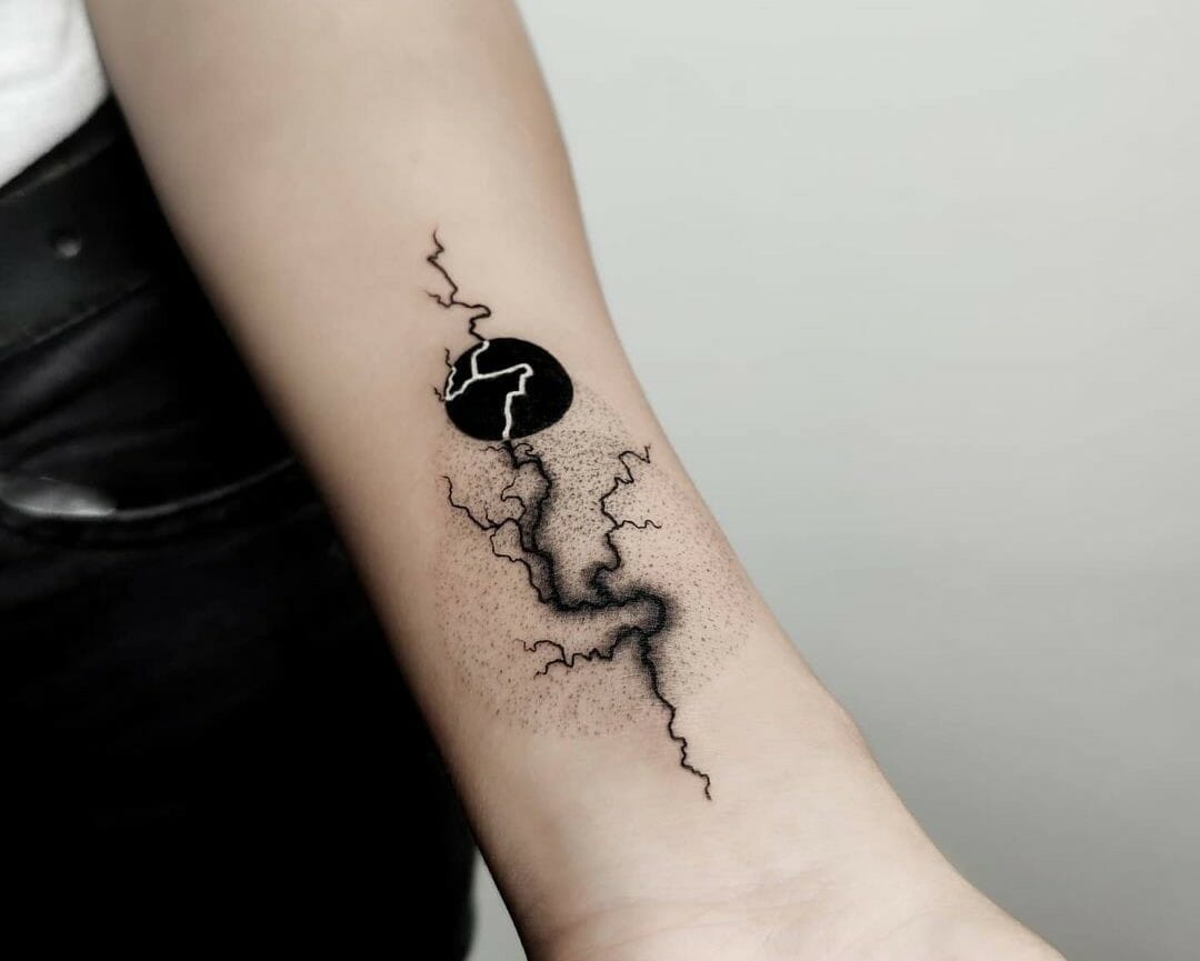 Minimalist lightning bolt tattoo in white ink.