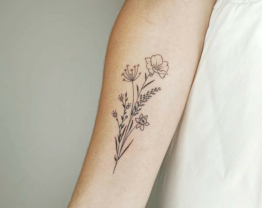 Tiny daisy tattoo on the ankle