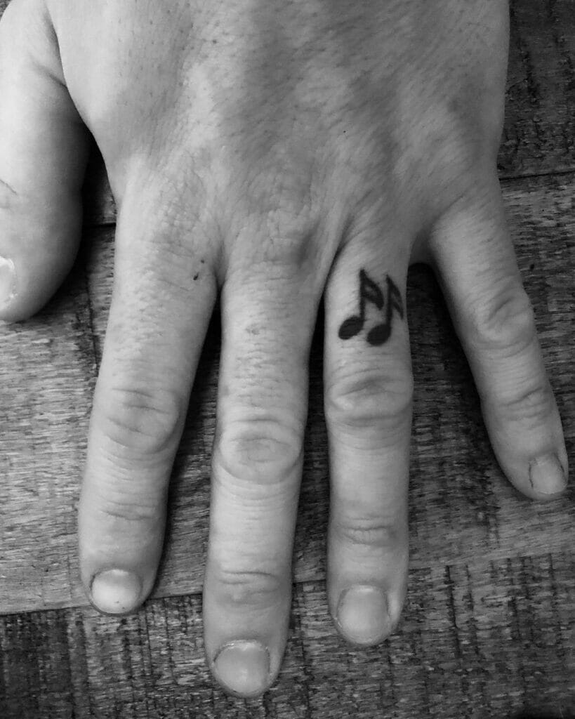 Minimalist Ring Finger Tattoo For Musicophiles