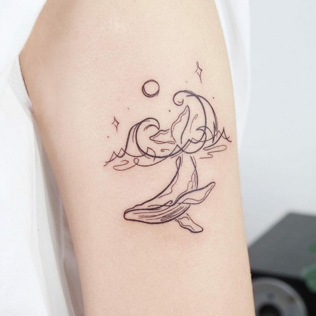 Minimalistic Whale Upper Arm Tattoo Idea