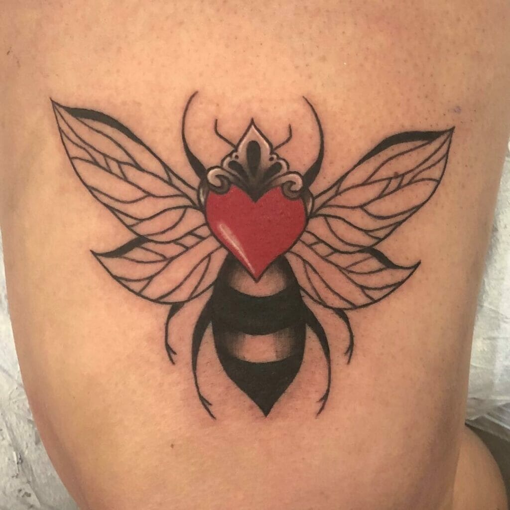 Monochrome Queen Bee Tattoo With Leafy Wings and A Vibrant Red Heart