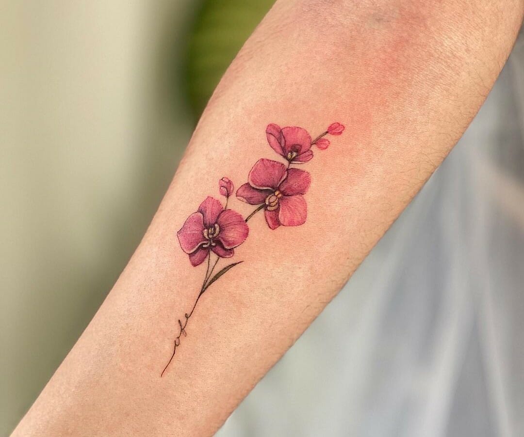 Hand poked orchid tattoo on the wrist.