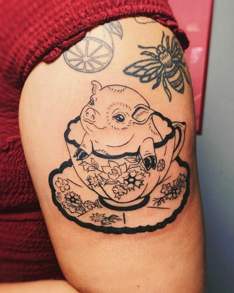 Piglet Sitting In Teacup Tattoo