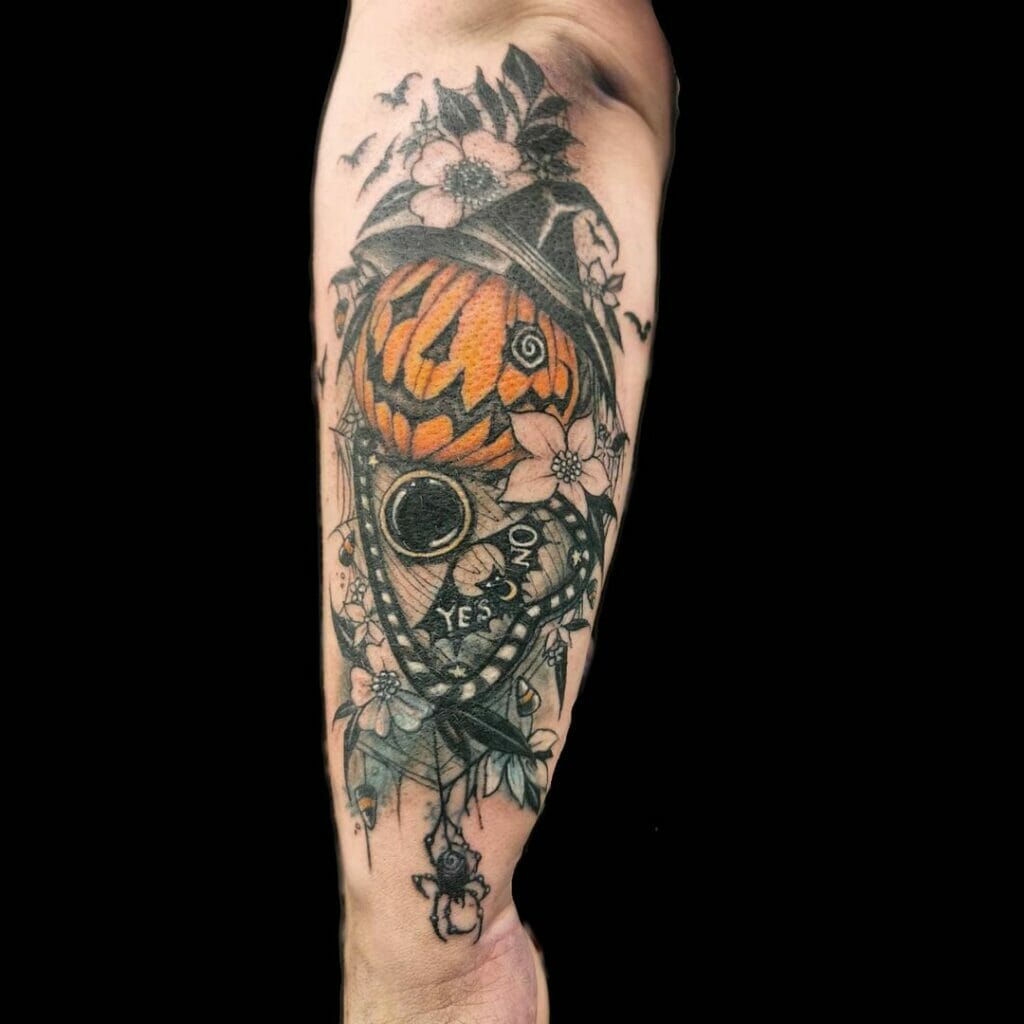 Planchette Hand Tattoo With A Pumpkin