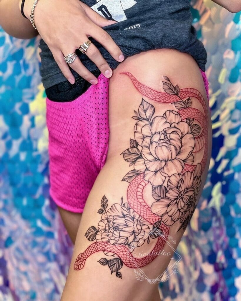 Red Snake And Flower Thigh Tattoo