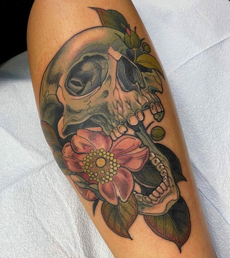 Skull With A Flower Growing Through The Mouth Tattoo Design