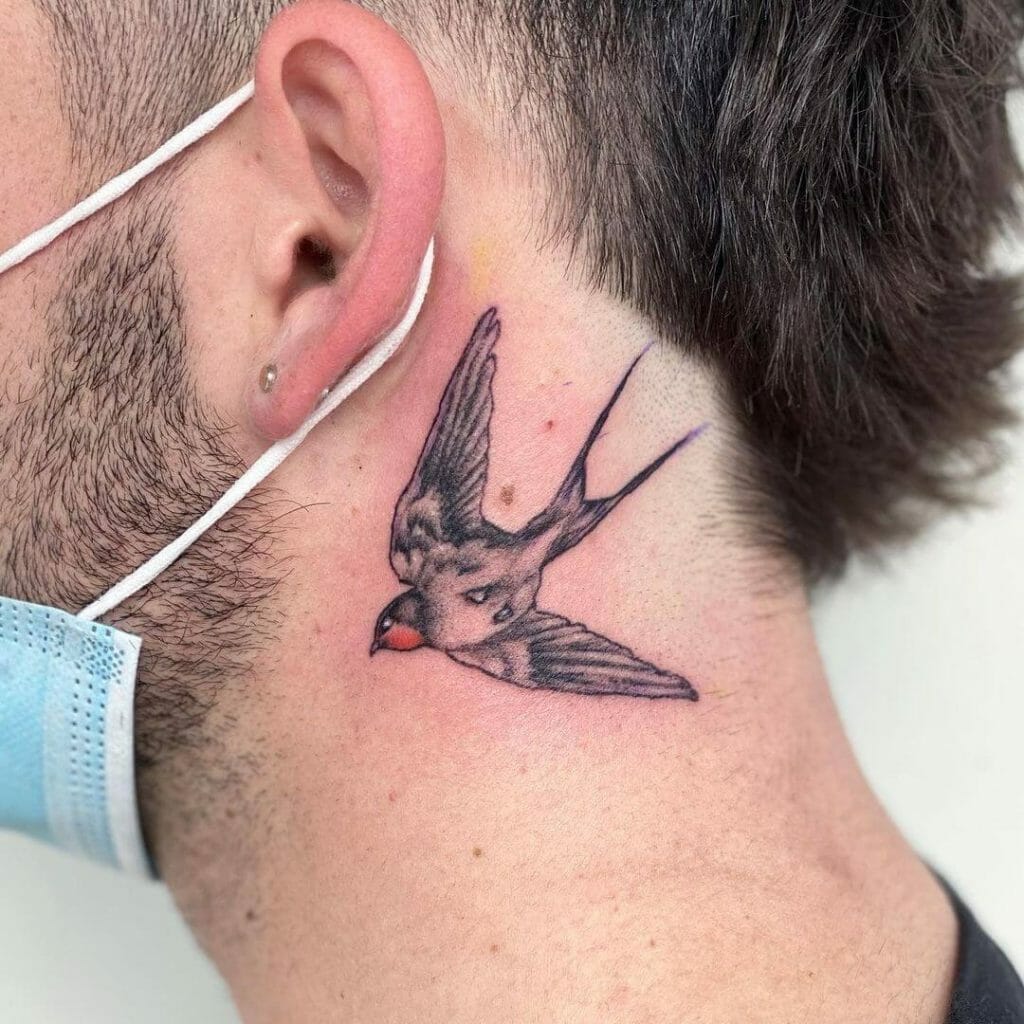 Small Bird In Flight Ear Tattoo
