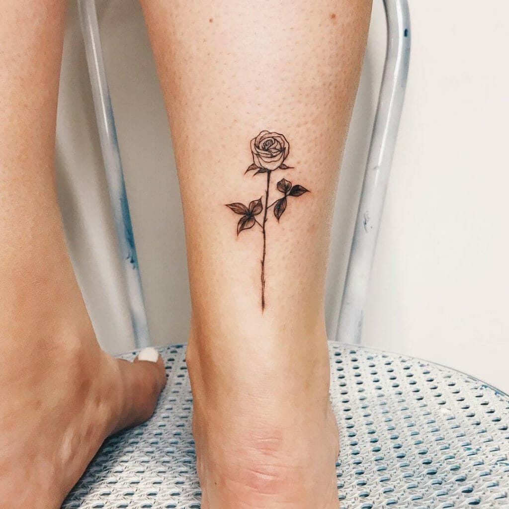 Small Colorless White Rose Tattoo On Leg