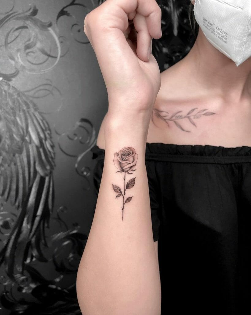 Small Flower Hand Tattoo