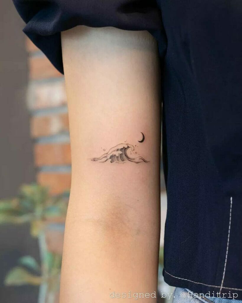 Small Ocean And Moon Travel Tattoo