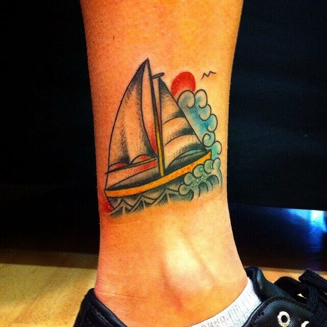 Small Sailboat Tattoo With Vivid Colours