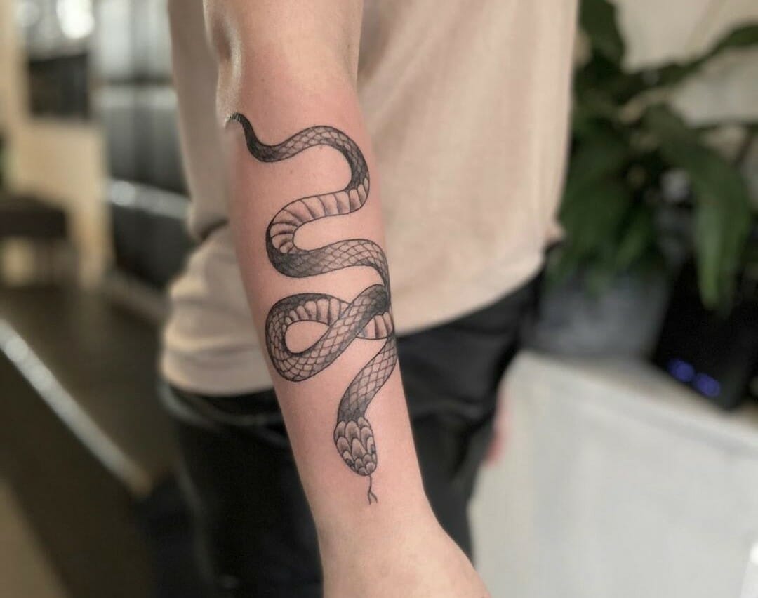 Snake wrapped around a flower  Tattoogridnet