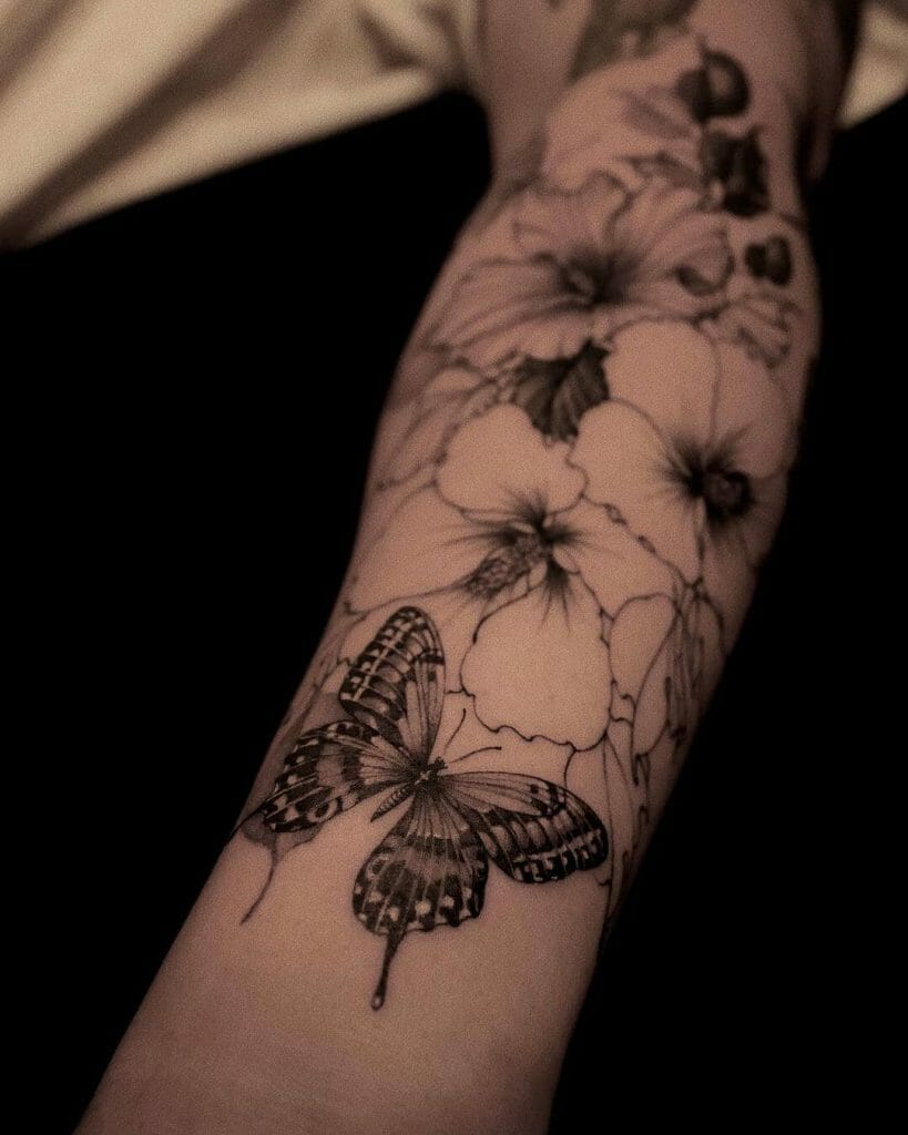 Stunning Grey And Black Butterfly Tattoo On Wrist