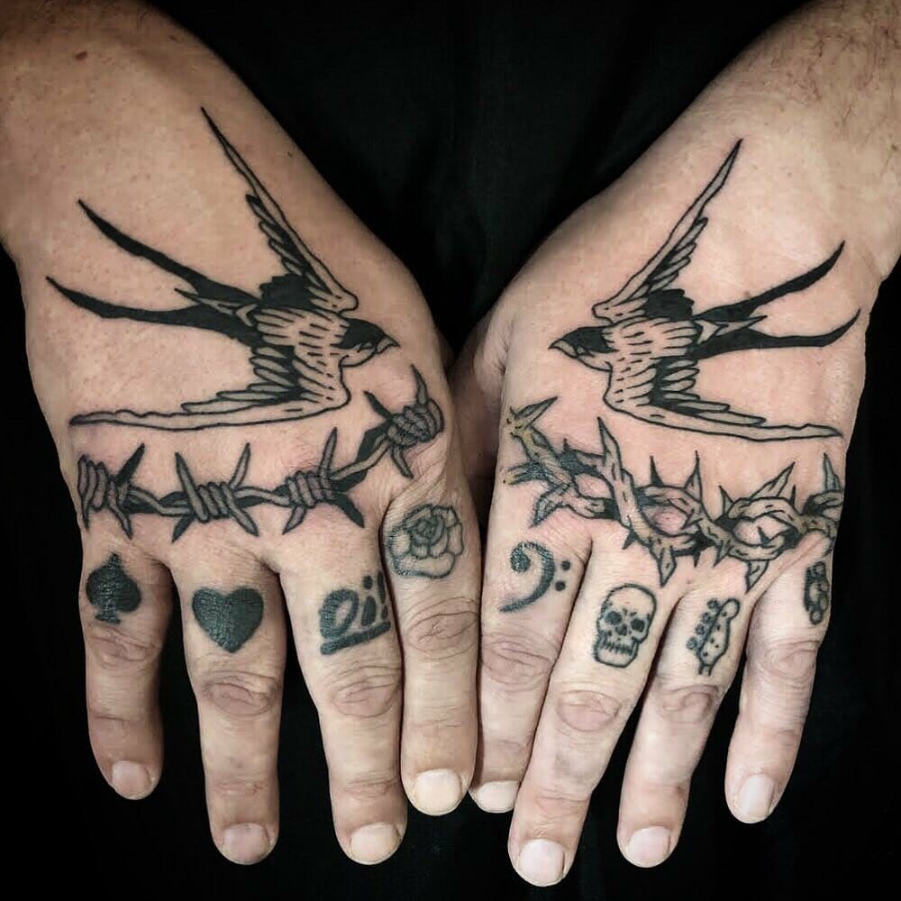 Swallows and Symbols Knuckle Tattoos