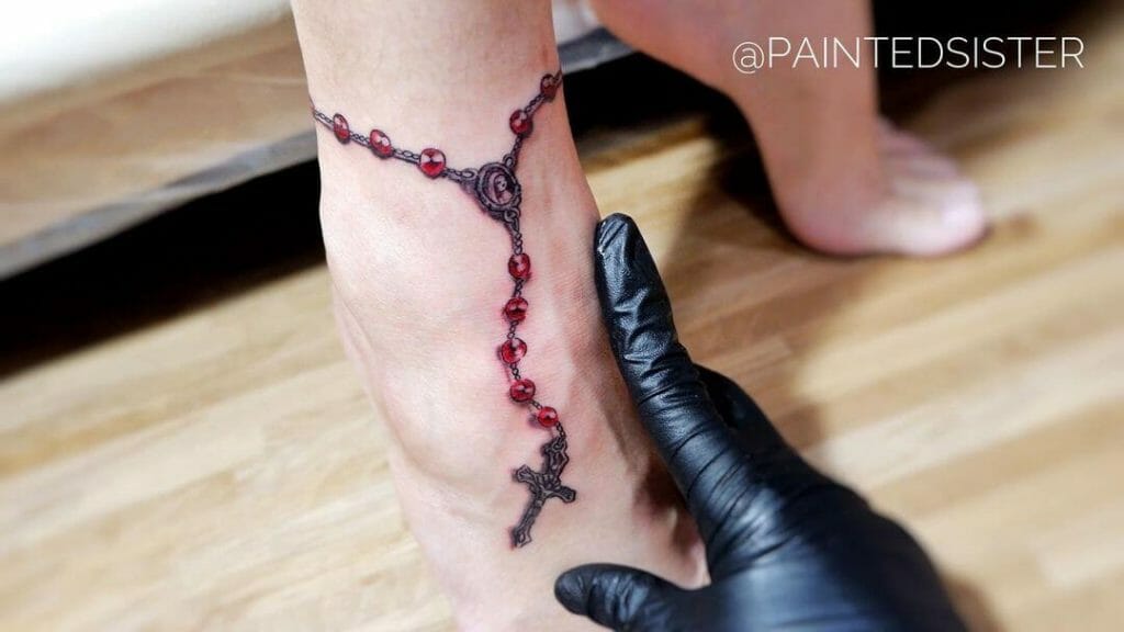 The Red Rosary Ankle Tattoo