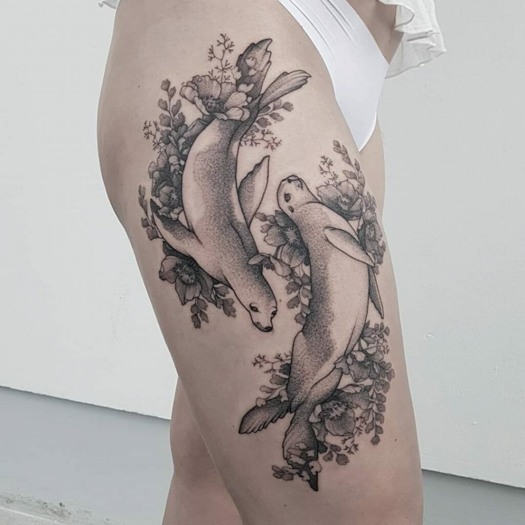 This Flowery Tattoo Of Two Seals