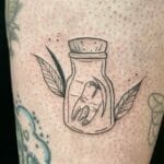 Tooth Tattoo on bottle 1 Outsons