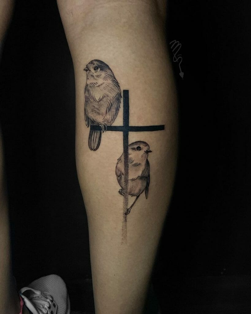 Twin Canaries On Cross Tattoo