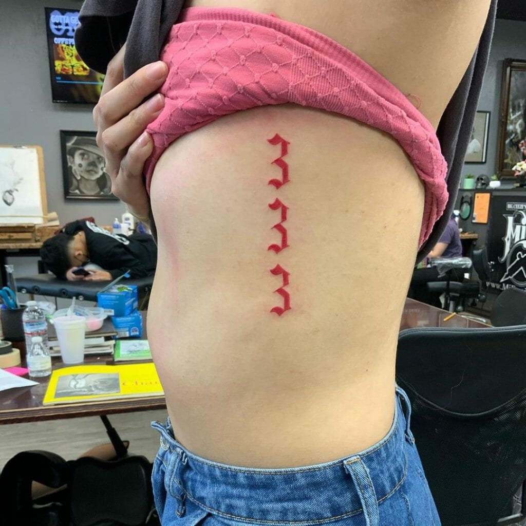Vertical 333 Tattoo In Red Ink