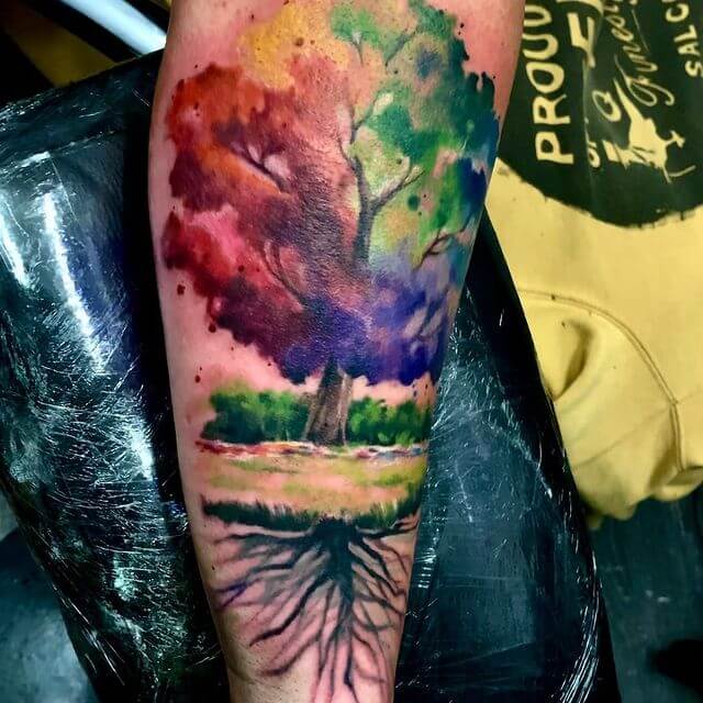 Vivid And Colourful Tree And Roots Tattoo