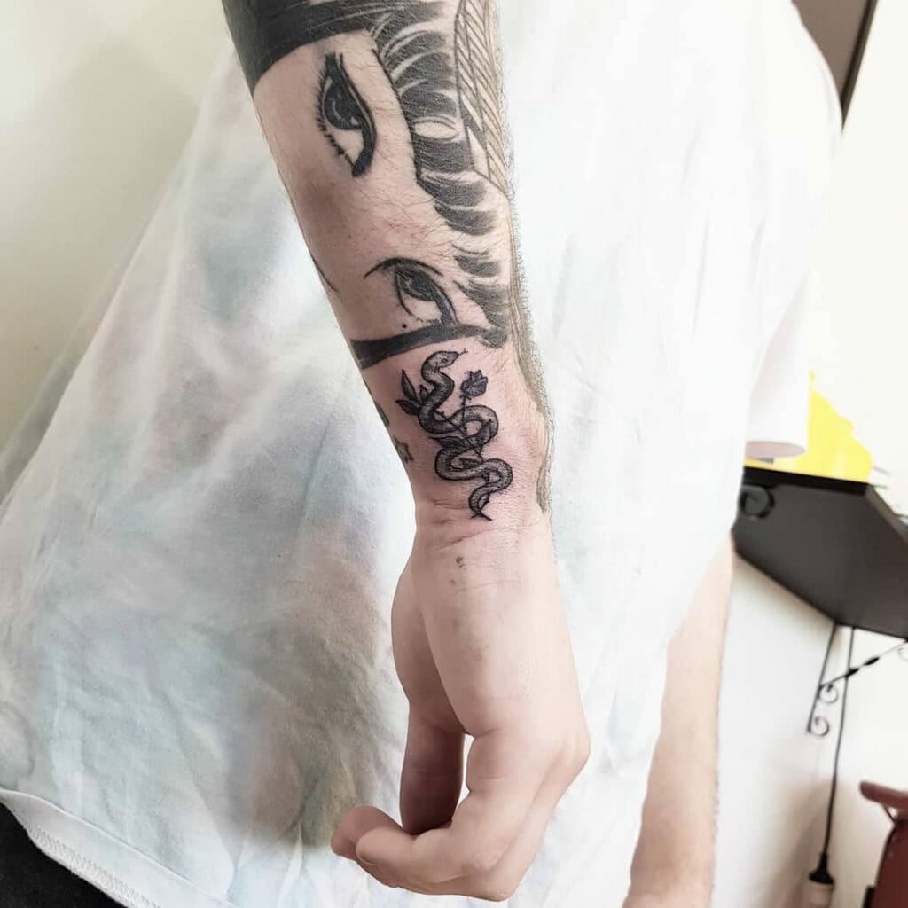 Wrist Snake And Flowers Tattoo
