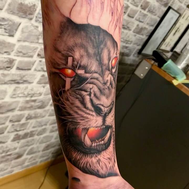 Angry Lion with Cross Eye Tattoo