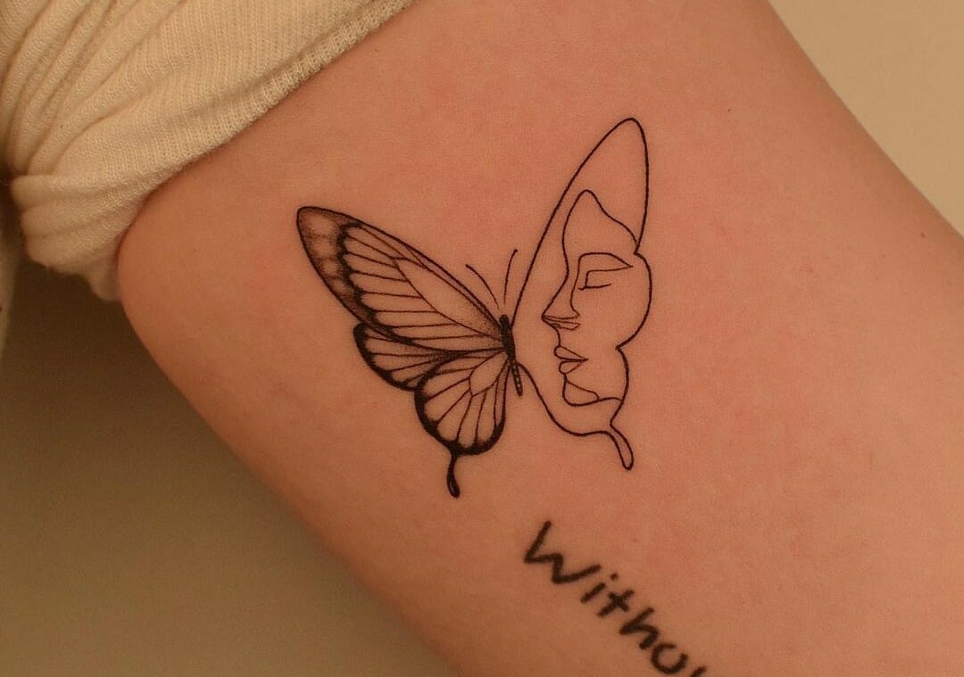 Single needle butterfly with an angel wing tattoo