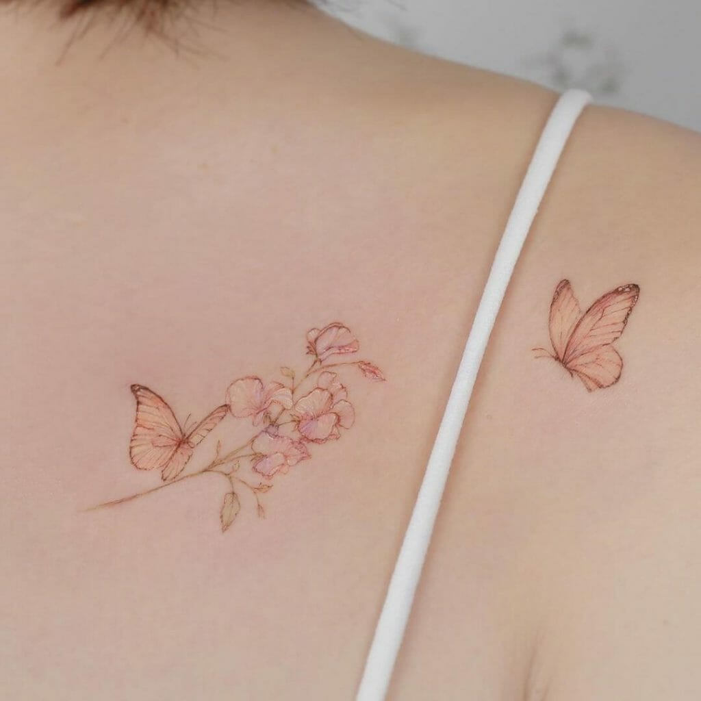 Butterfly Tattoo With A Flower On The Upper Rib Cage