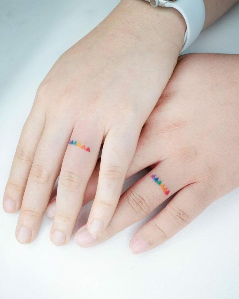 Cute Minimalist Rainbow Hearts Tattoo On Finger