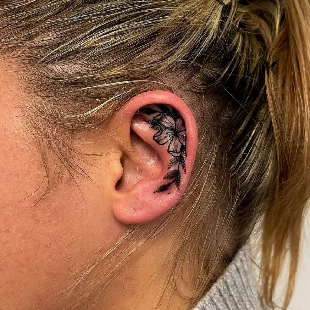 Dark Black Ear Flowered Tattoo