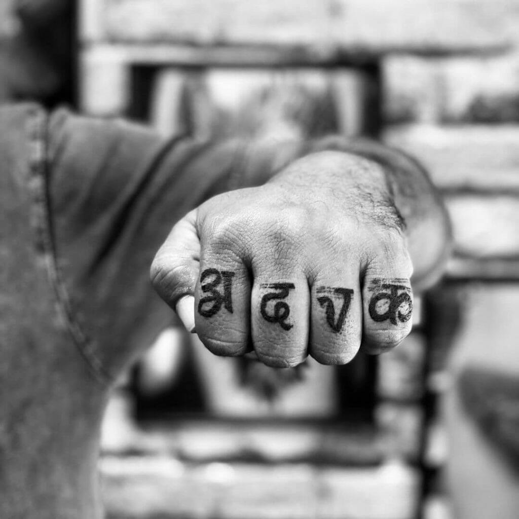 Devnagari Initial Tattoo on Finger